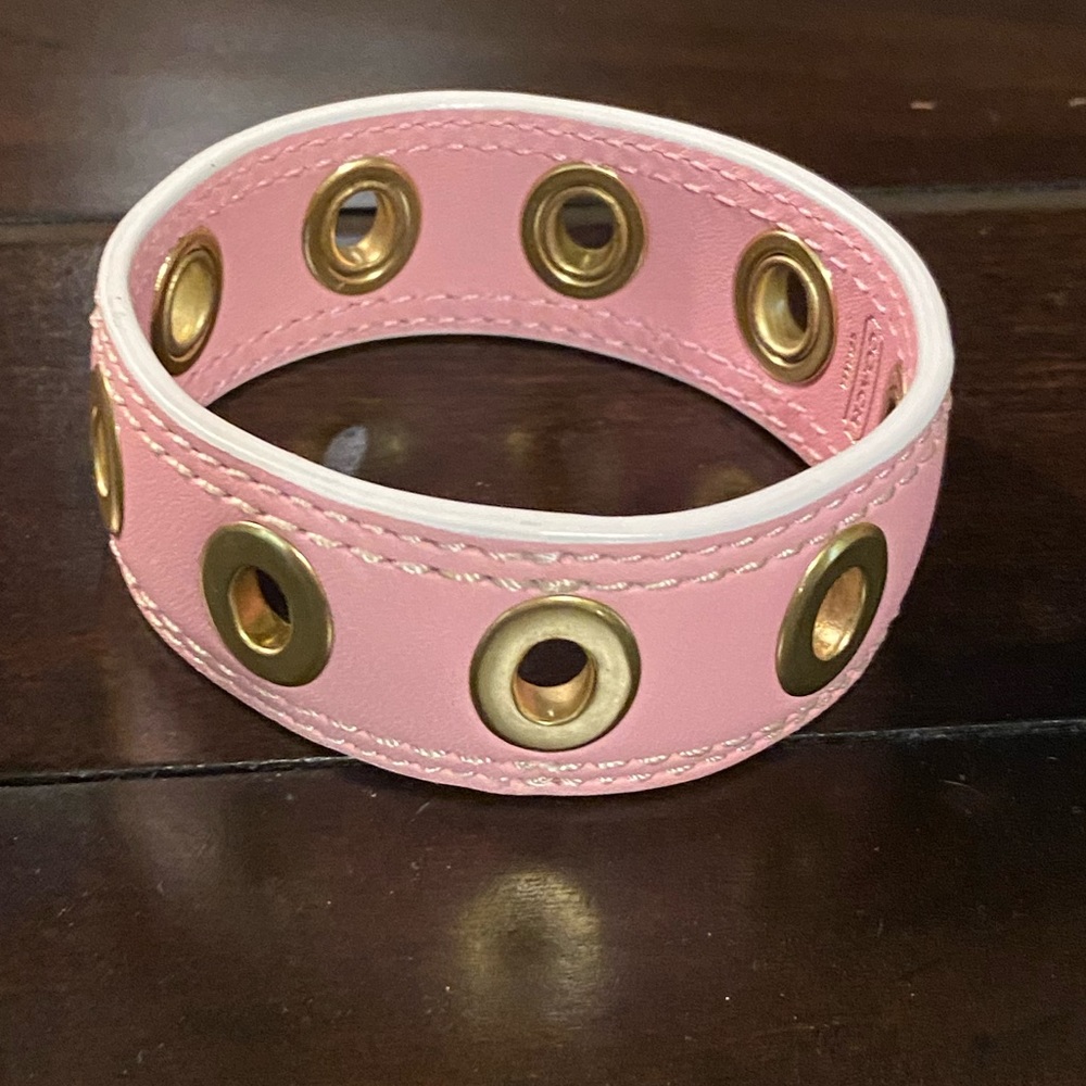 Coach Pink bracelet with Gold grommets